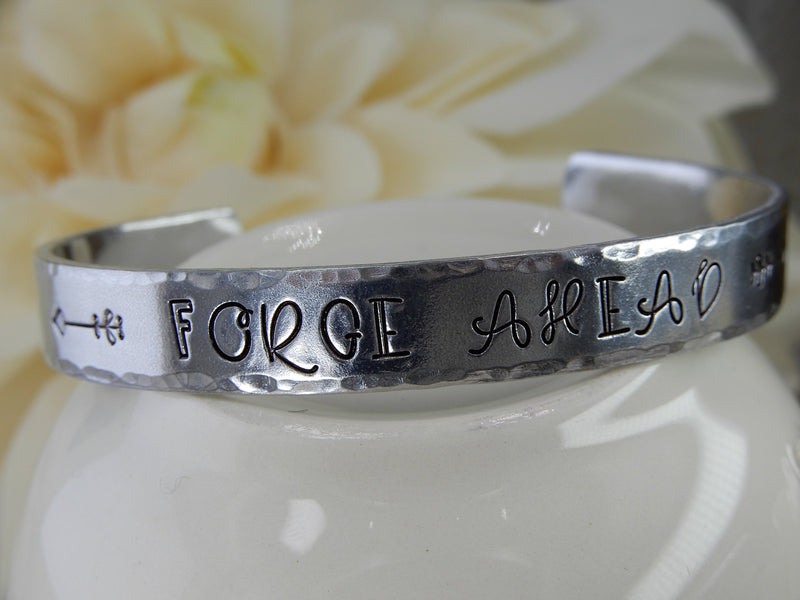 Forge Ahead Stamped Aluminum Cuff